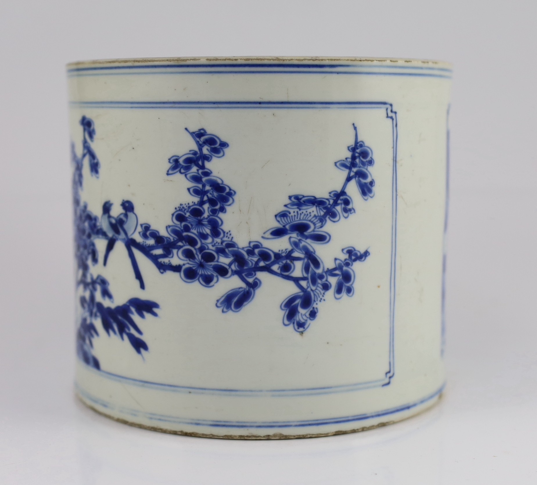 A Chinese blue and white ‘landscape’ brushpot, bitong, Kangxi period, 17.8cm diameter, 15.2cm high, fritting to edges